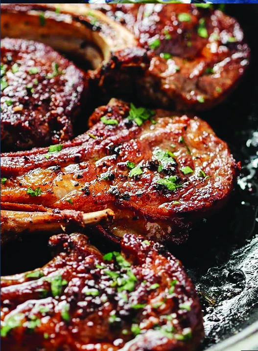 Grilled meat with vegetables, pictured in the Amwaj menu