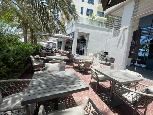 Among the palms · The Amwaj terrace