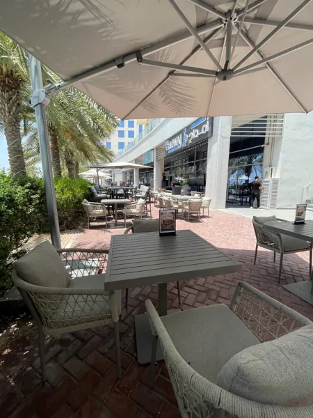 Among the palms · The Amwaj terrace